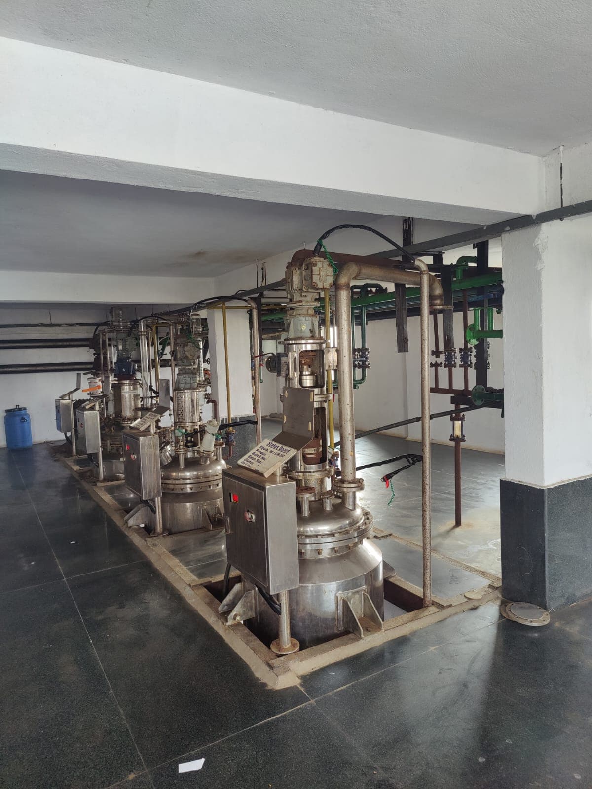 Production area with reactor vessel and piping